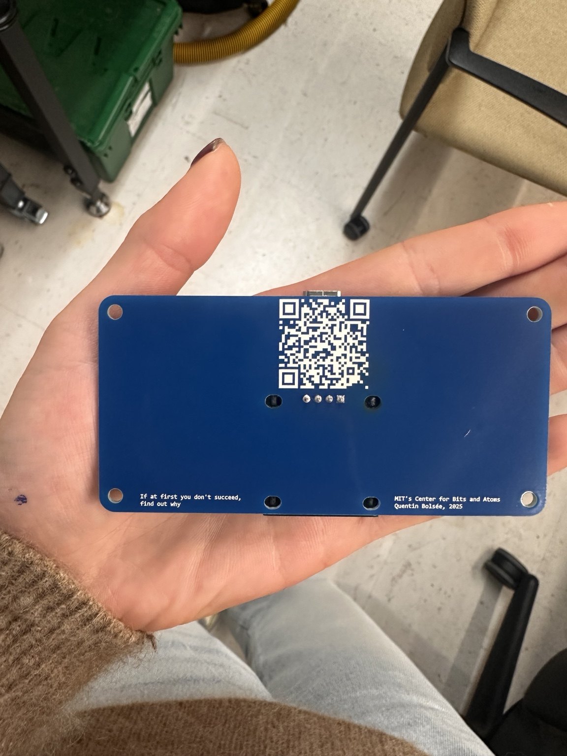 Reverse side of the finished QPAD with a QR code and a printed debugging quote