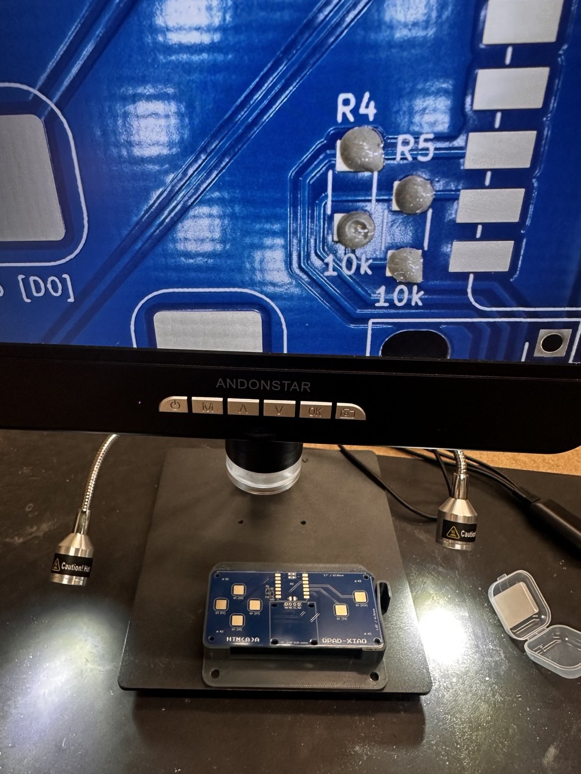 Digital microscope examining solder paste on R4 and R5 resistor pads of the blue QPAD PCB