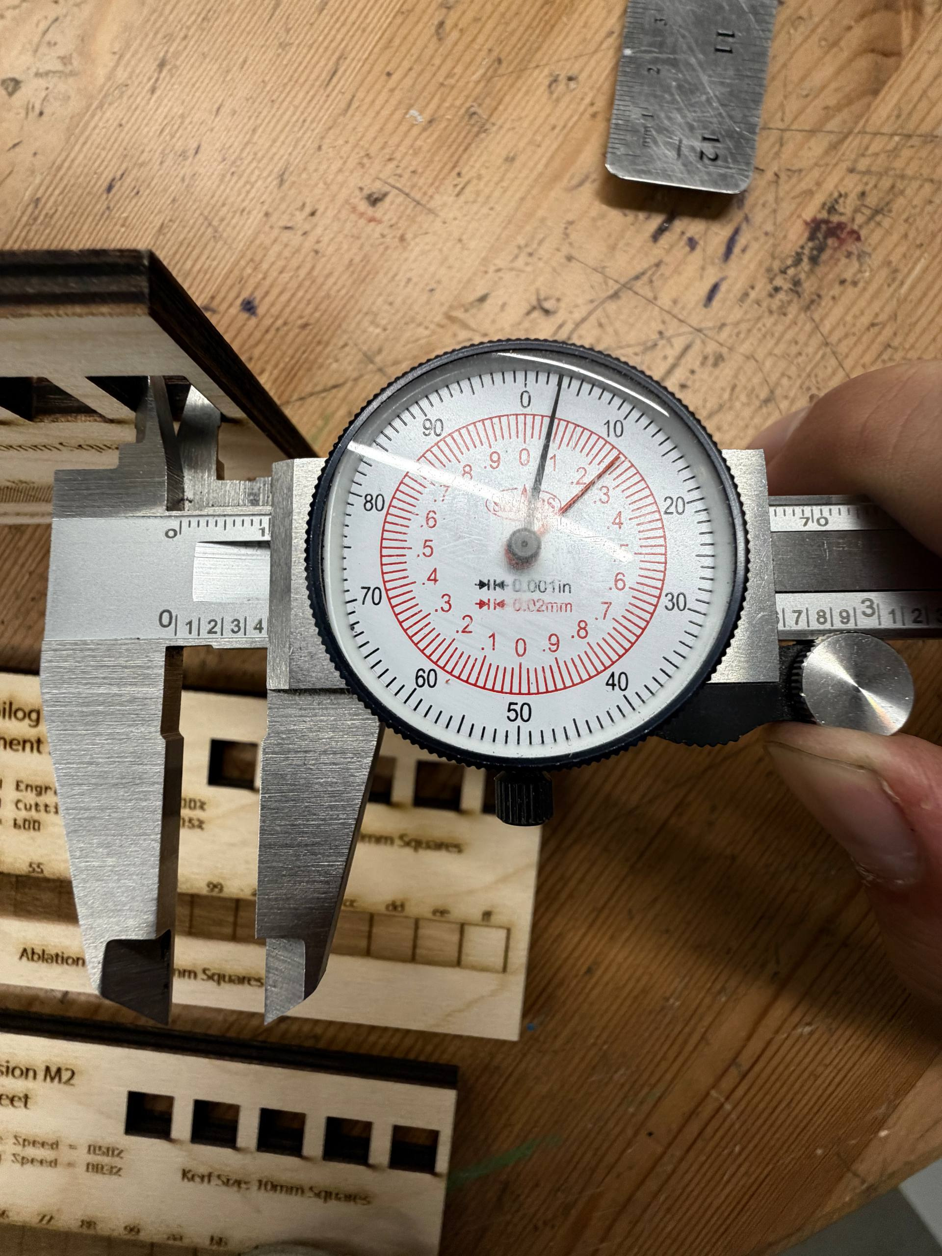 Measuring kerf using caliper inner jaws