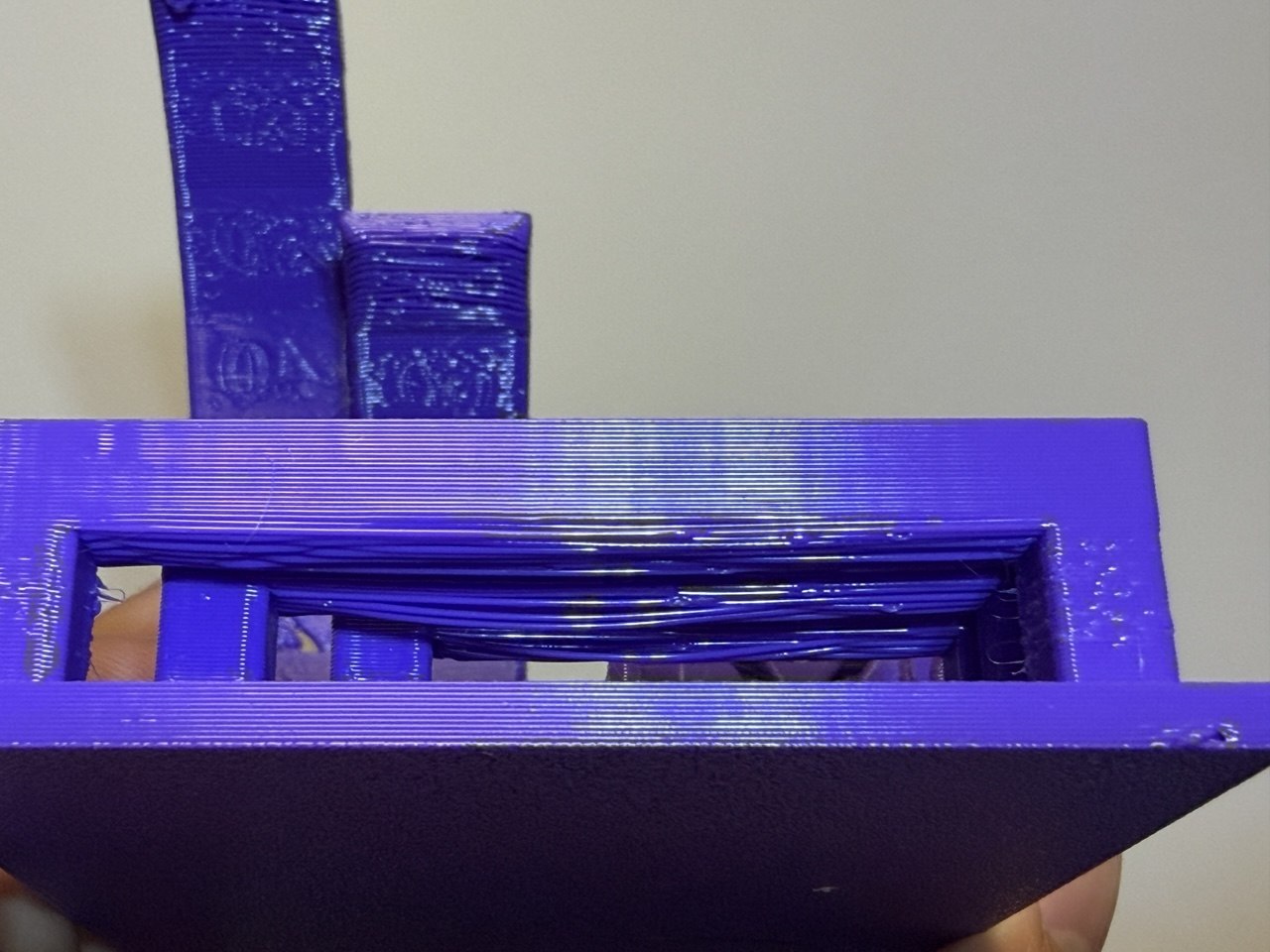 Sagging filament from bridging tests