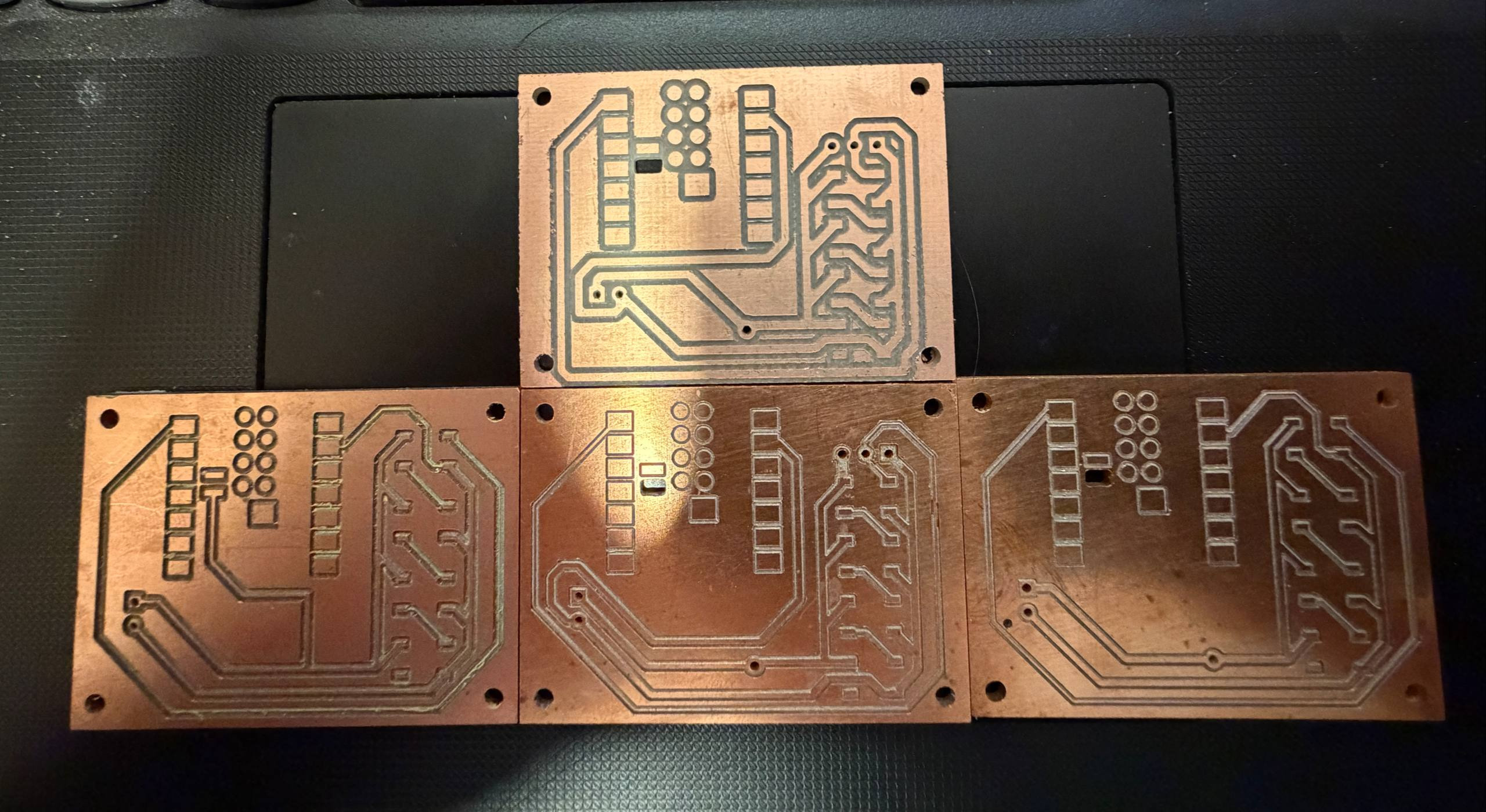 Examples of inconsistent trace widths from the engraving bit, from later boards. Top: milled with 1/32" end mill. Bottom 3: milled with engraving bit.