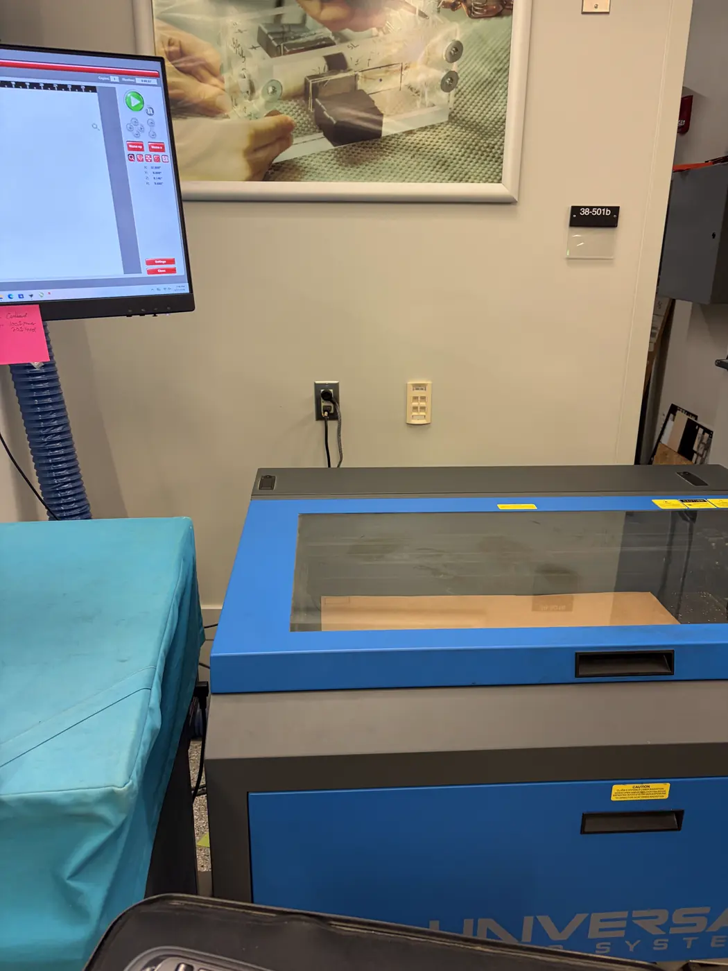 Laser cutter and control workstation in the EDS lab