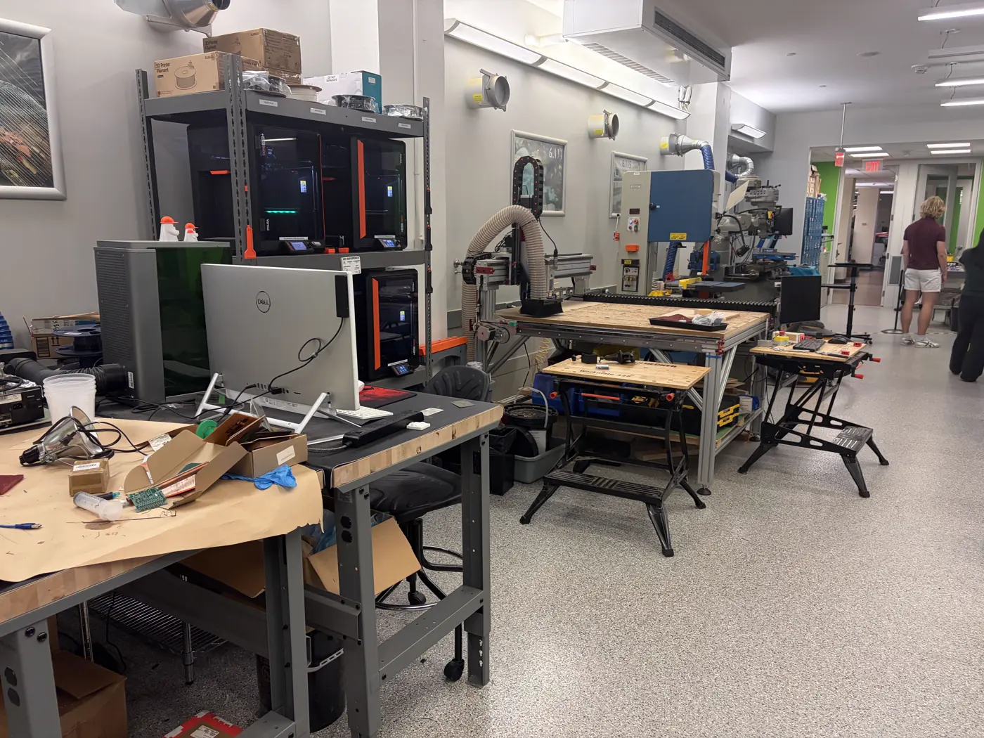 Stratasys 3D printer, microscope, and electronics workbench in the EDS lab