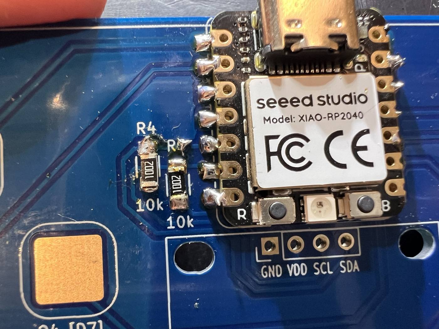 Extra solder material on one of the two 10k resistors