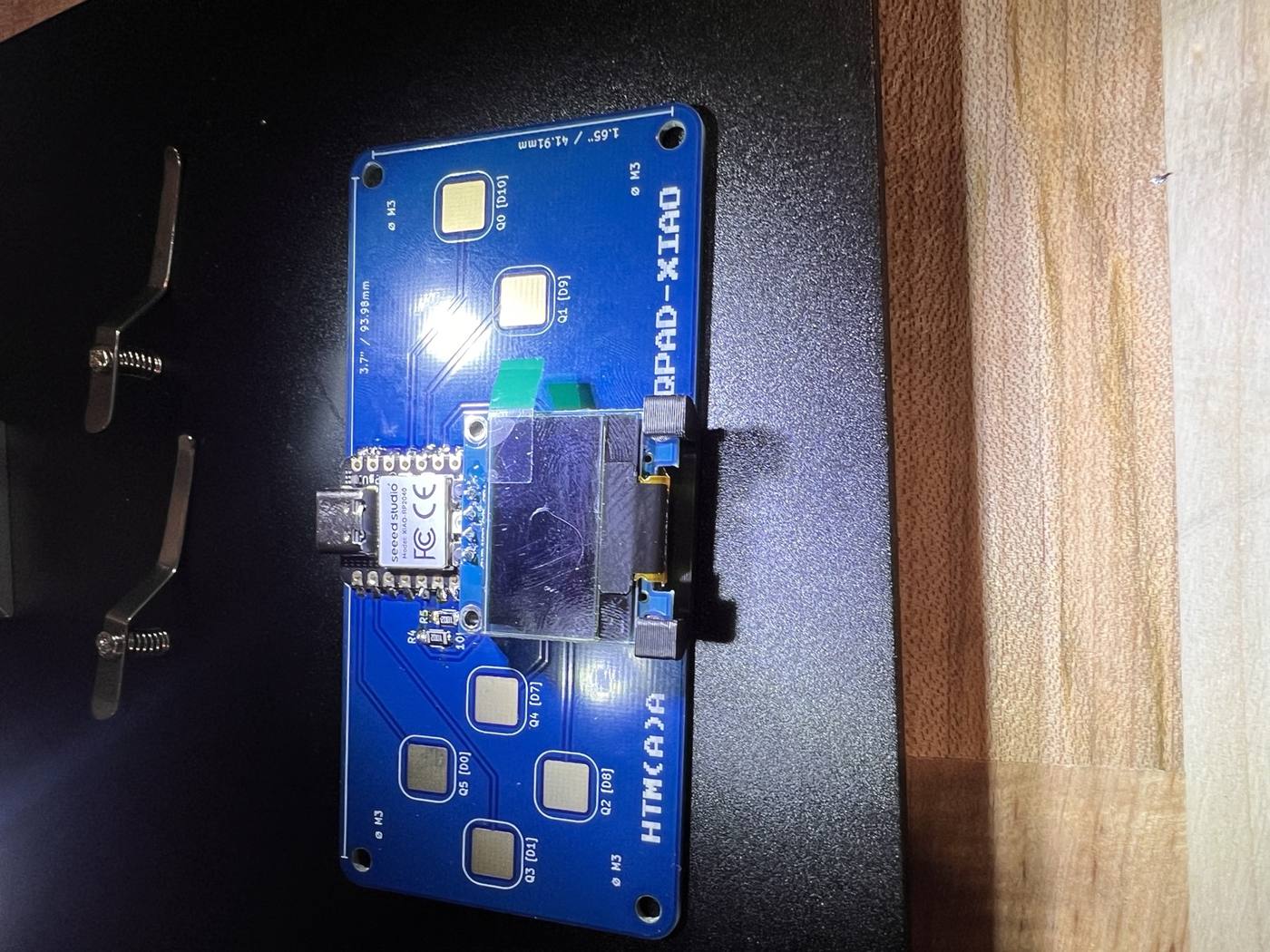 The assembled QPAD: XIAO, resistors, and OLED display in place