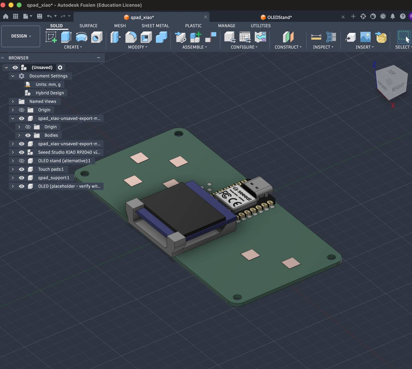 Exported board imported into Fusion along the XIAO RP2040, the OLED screen on its stand and the touch pads