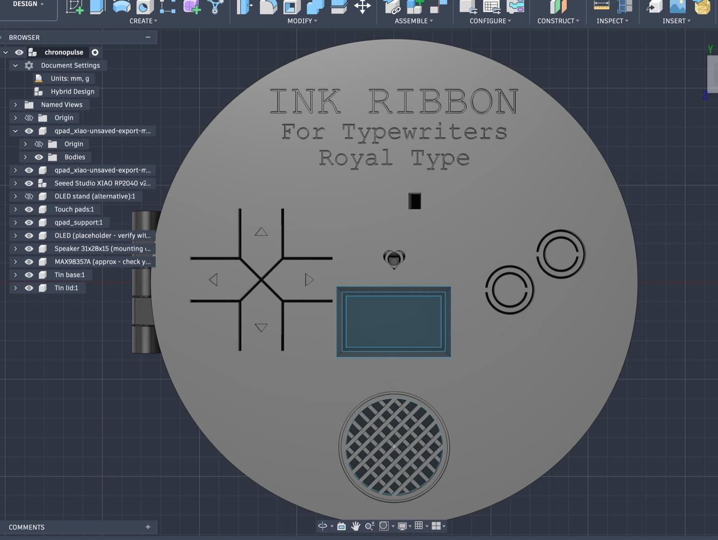 Lid with engraved typewriter-tin label, D-pad with arrow markings, ring-cut buttons, heart window, screen window, power window, speaker grille and hinge