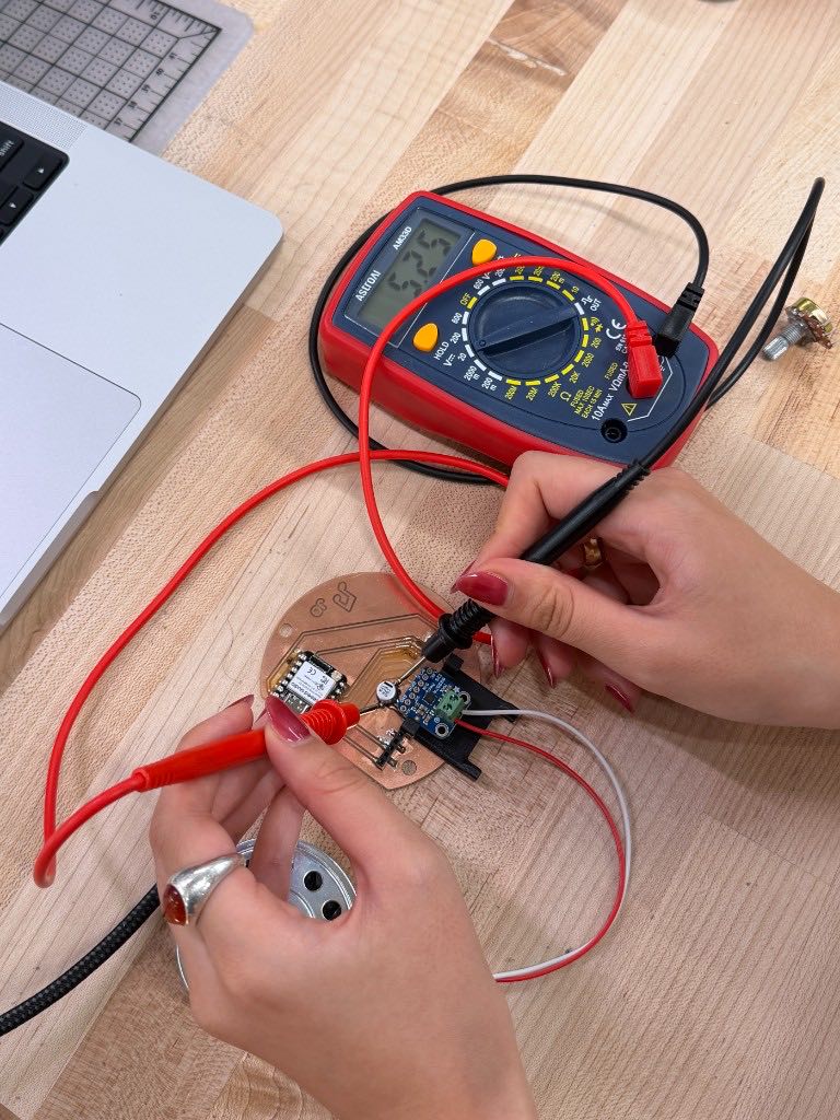 Testing the assembled board with a multimeter and probes