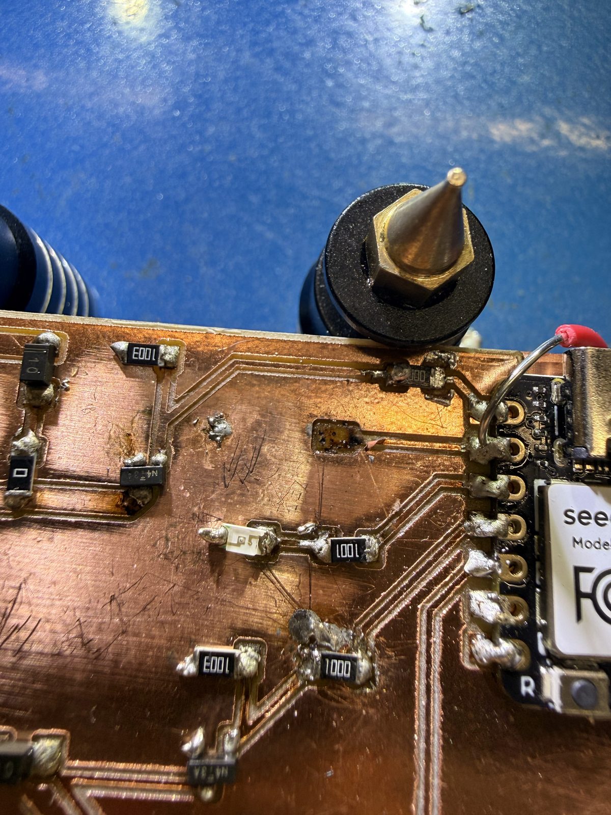 Close-up of soldered resistors and MOSFETs