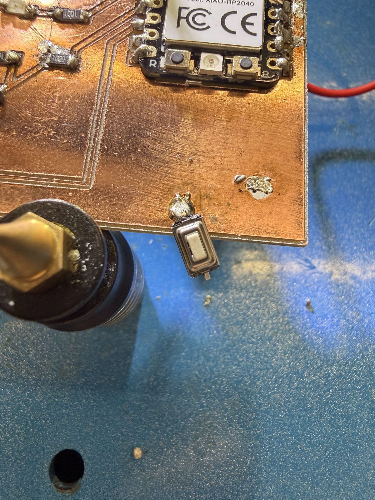 Close-up of a soldered part next to the Xiao