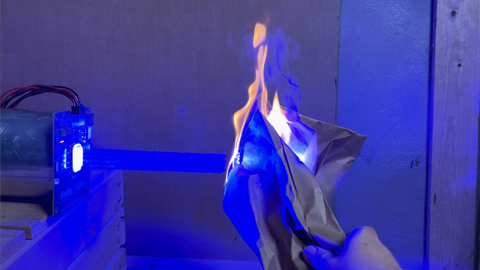Laser beam burning paper