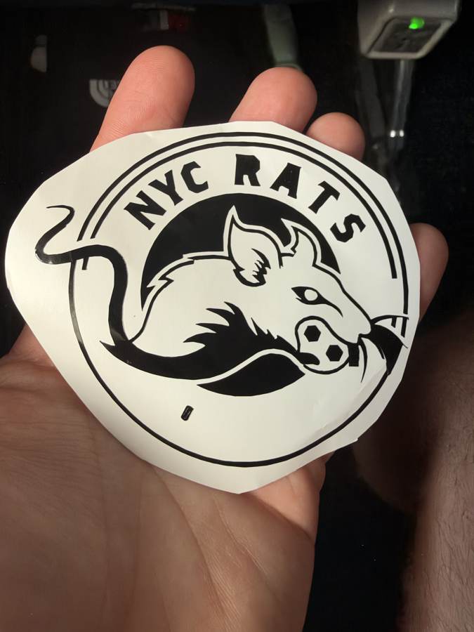 The finished NYC RATS sticker held in a hand