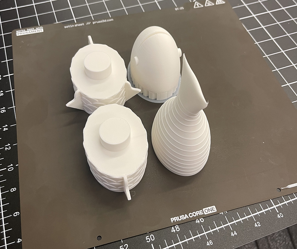 Printed fish parts on the build plate.