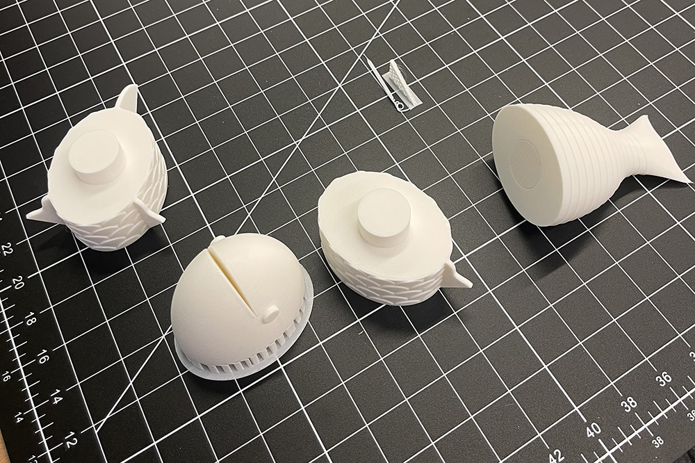 Printed fish parts with supports still attached.