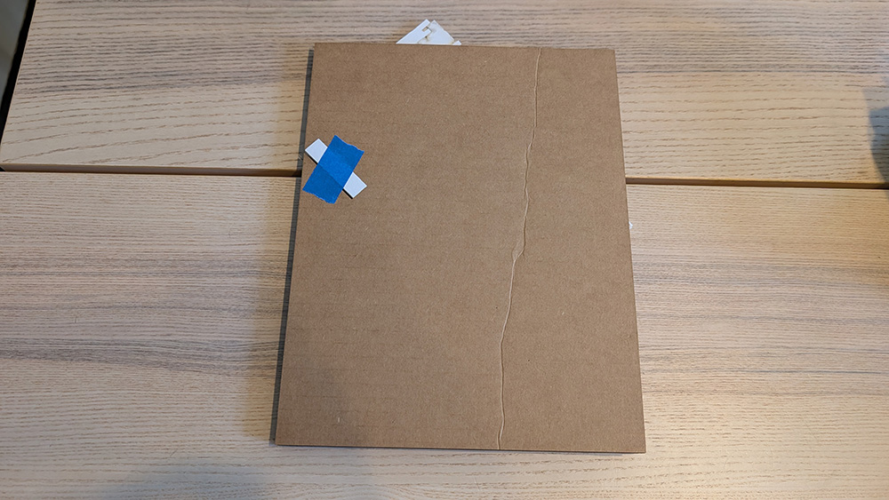 Closed mock-up: the cardboard base is too small to hide the folded plates.