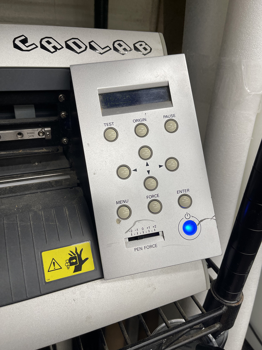 Pen force slider on the vinyl cutter set to −0.5.