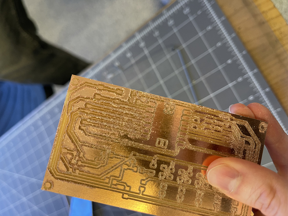 Deburring the milled board with a Scotch-Brite pad.
