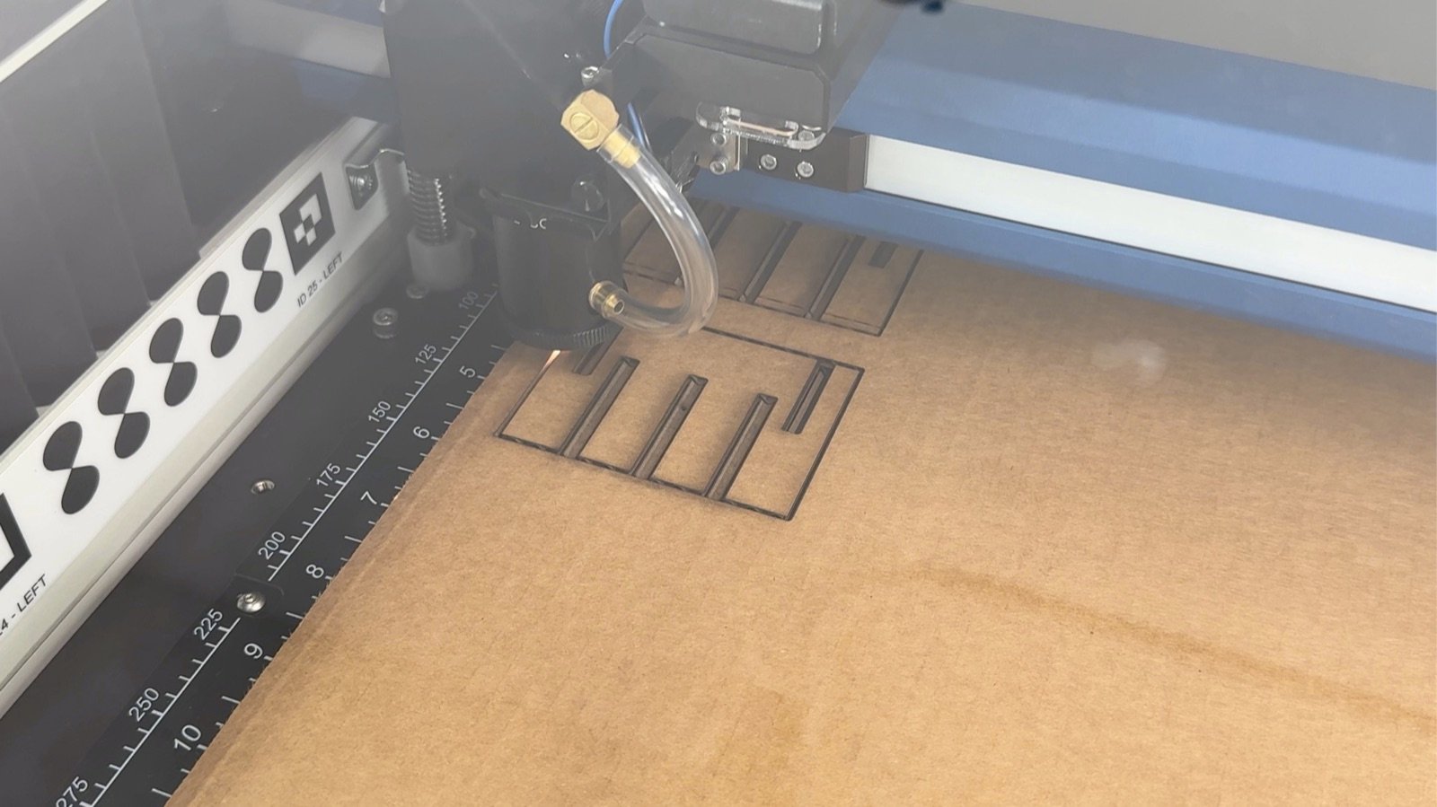 Epilog laser cutting a slotted cardboard rib