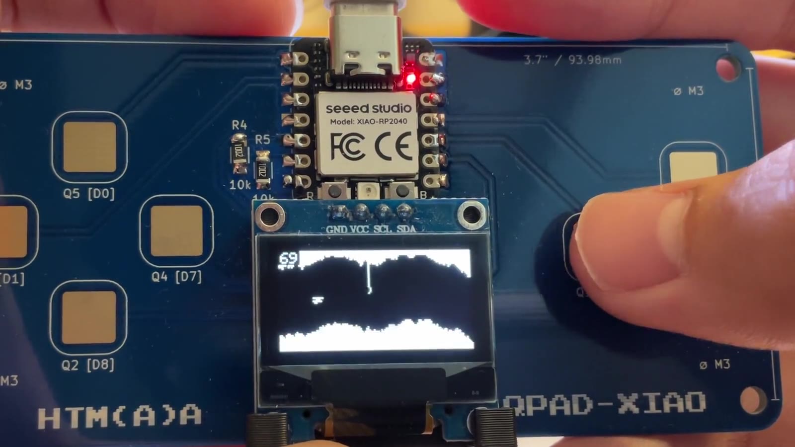 QPAD Heli on the OLED: the cave, a pillar, and a finger on pad A