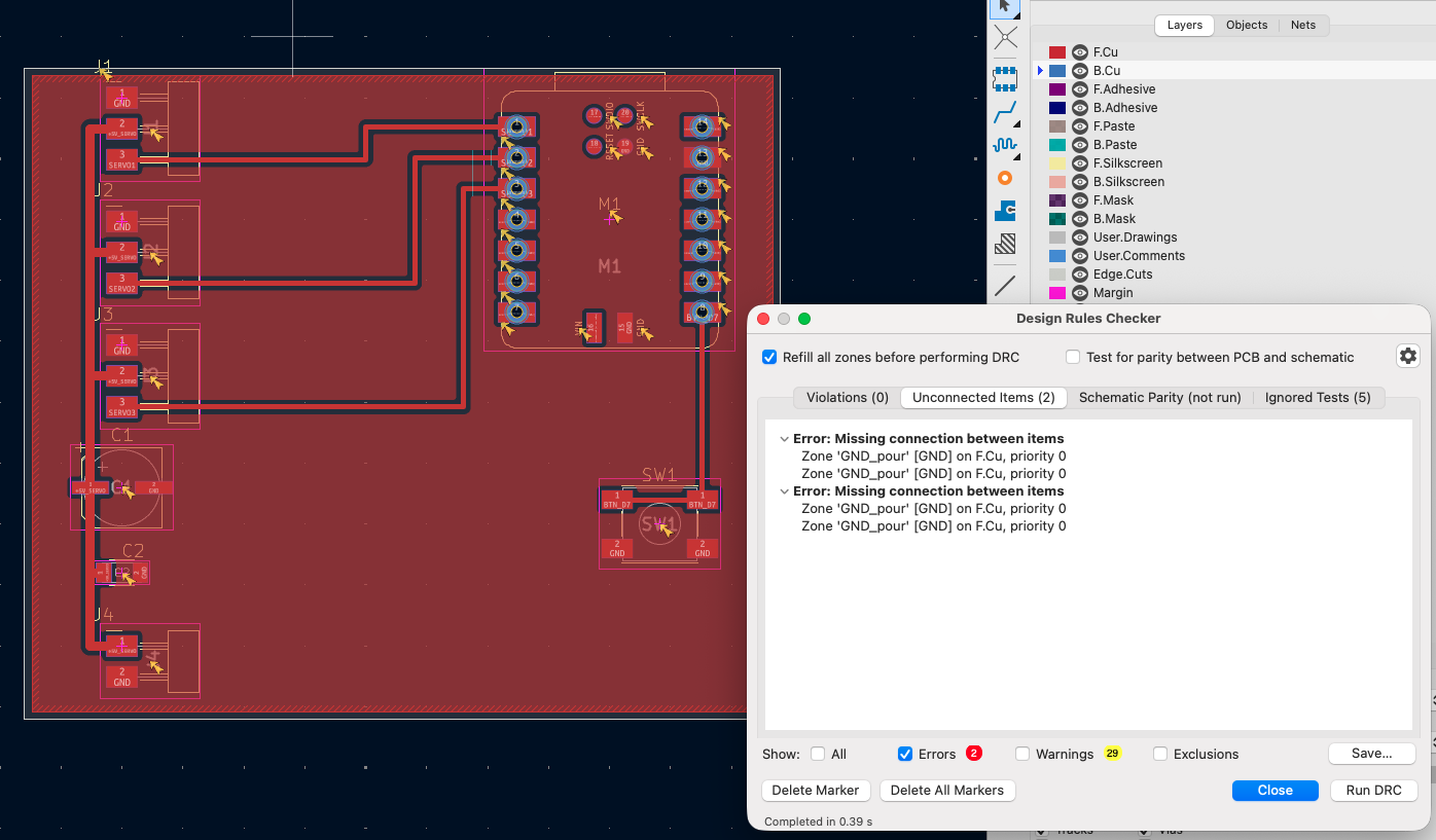 KiCad PCB editor with the Design Rules Checker open, listing two missing connections between zone GND_pour and itself