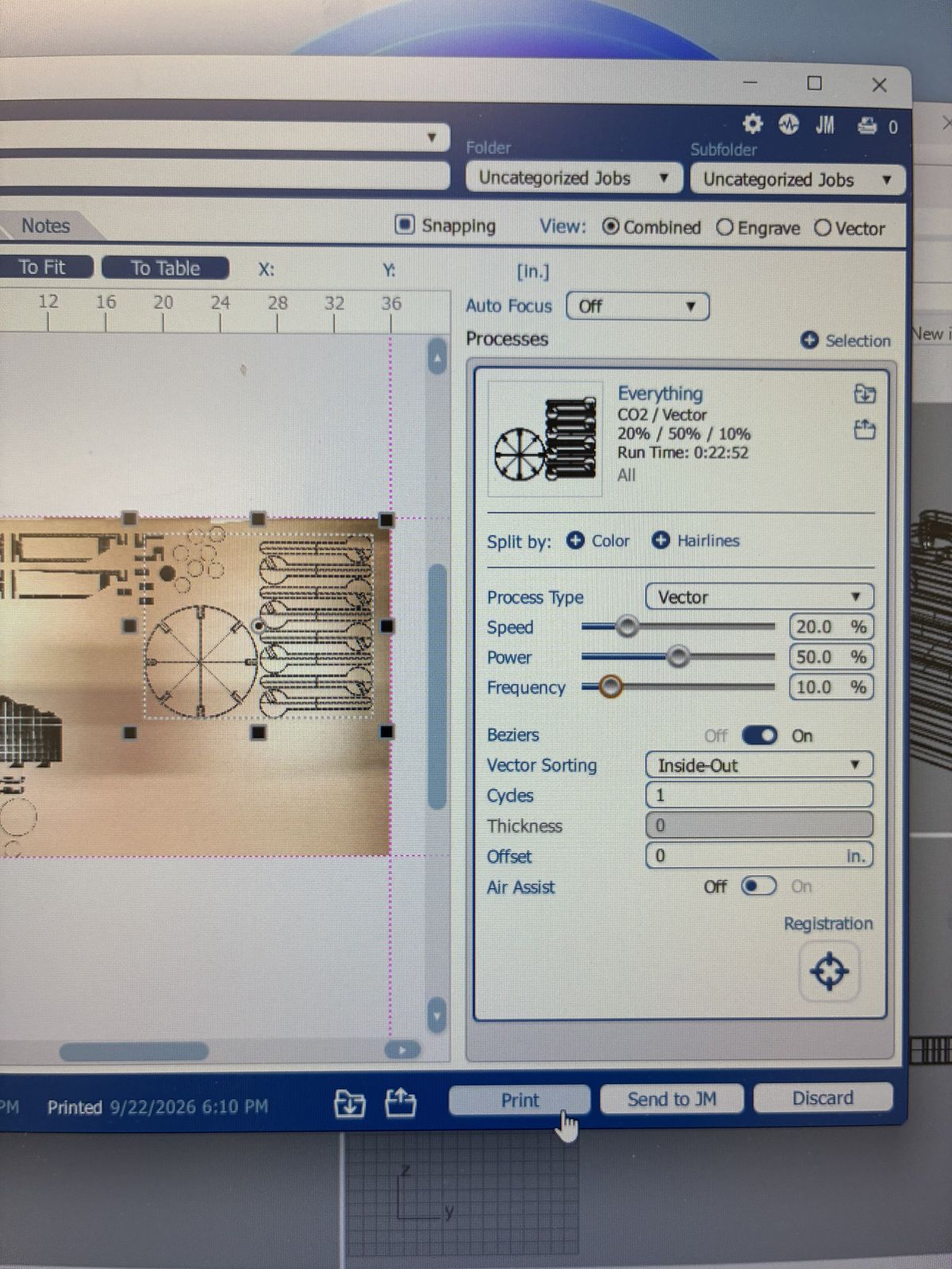 Epilog job manager screen showing a CO2 vector process at 20 percent speed, 50 percent power and 10 percent frequency, with a run time of 22 minutes 52 seconds