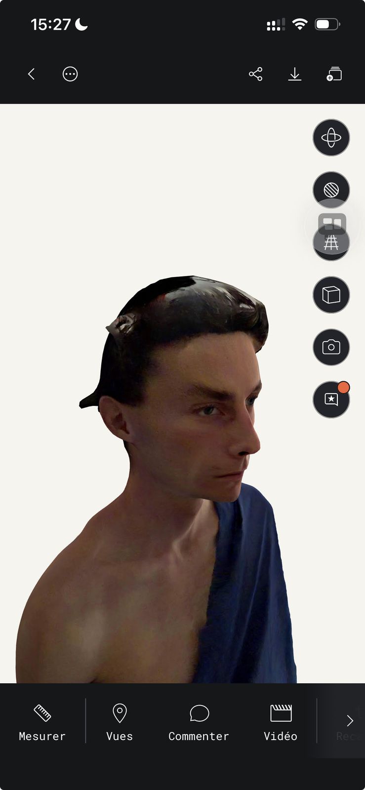 Screenshot of the Polycam app showing the first 3D scan of Victor's head and shoulders, draped in a blue bedsheet like a toga, with a dark distorted patch across the top of the head