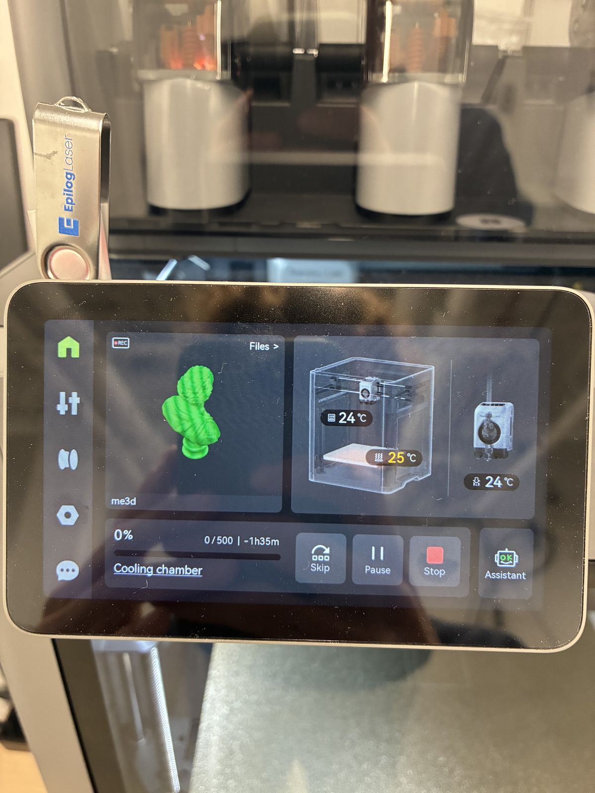 Touch screen of a Bambu Lab printer showing the bust file named me3d in green, at 0 percent, 0 of 500 layers, with 1 hour 35 minutes remaining