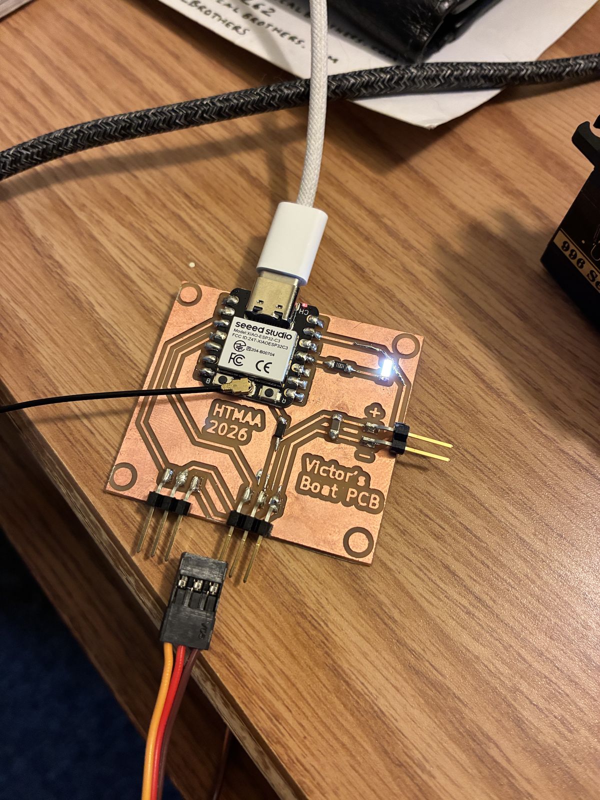 The finished board plugged in over USB-C with its small white status LED glowing next to the XIAO