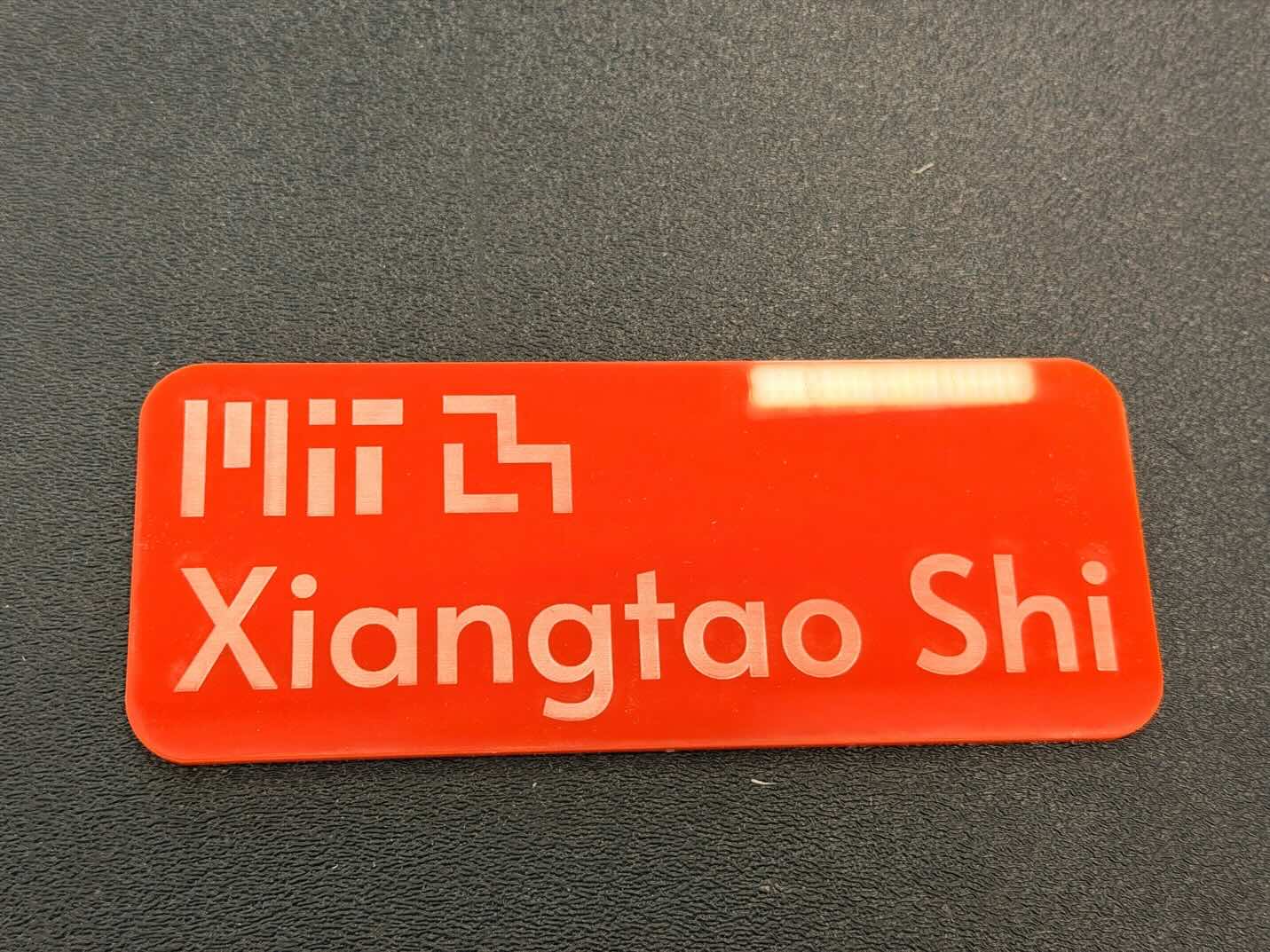 Red acrylic desk name tag engraved with Xiangtao Shi