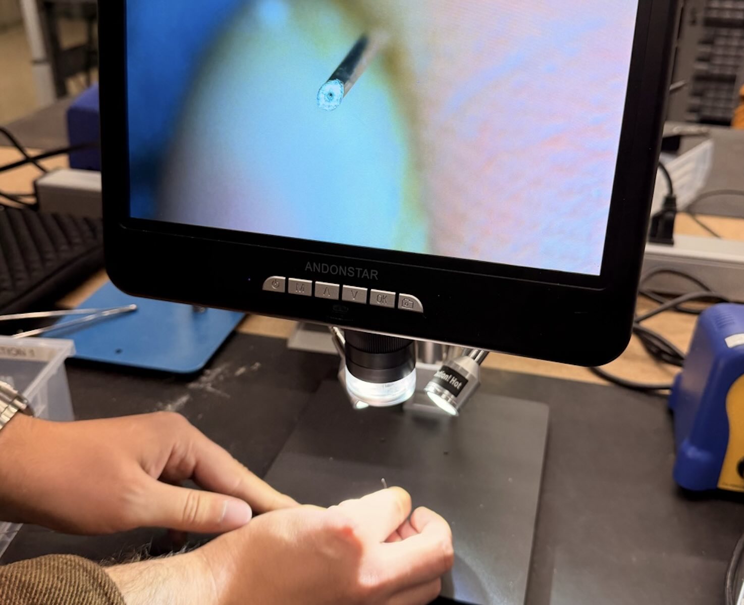 A magnified view of soldering shown on a monitor during training