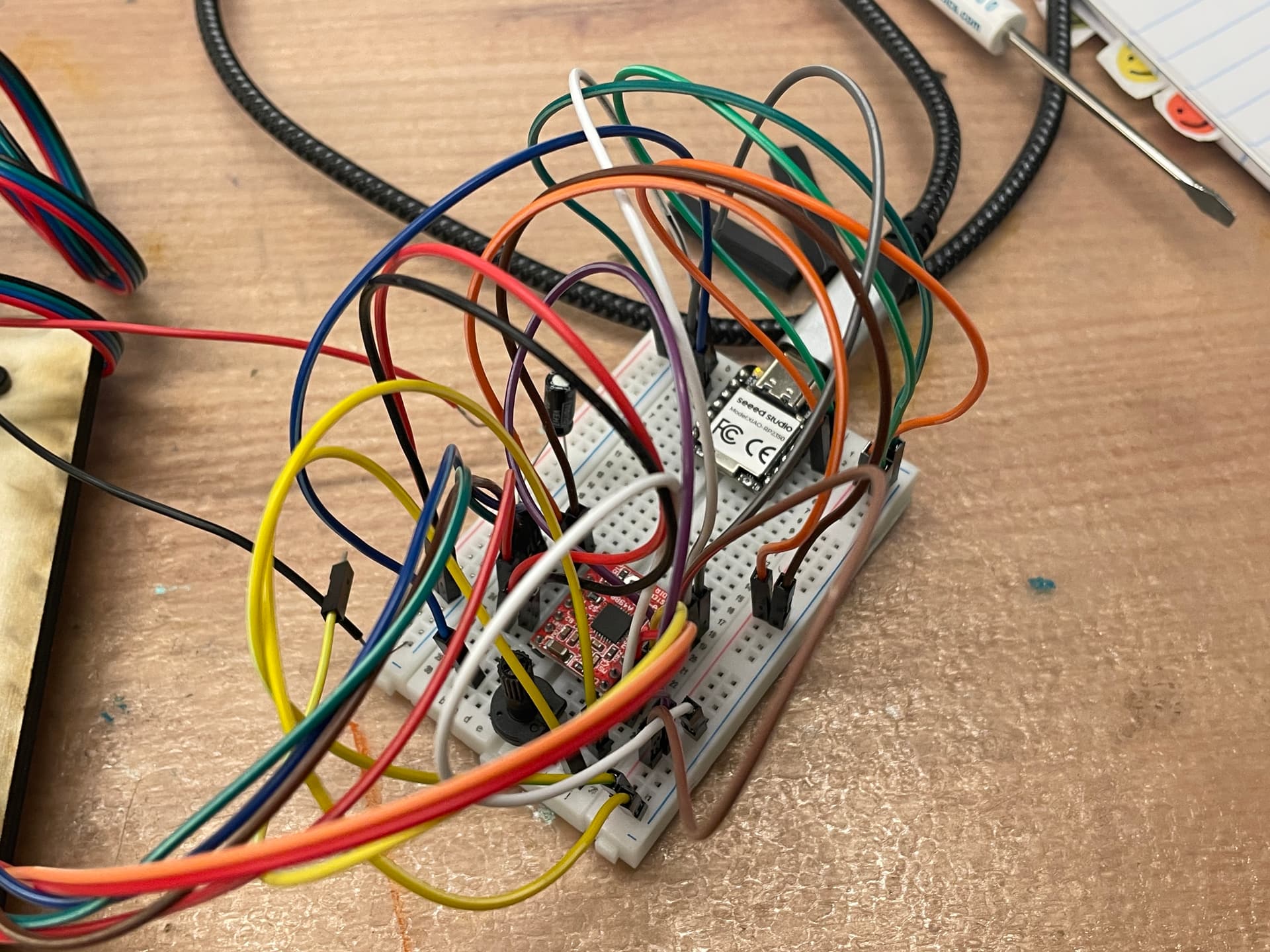 The previous breadboard prototype with the XIAO, A4988, potentiometer, and jumper wires