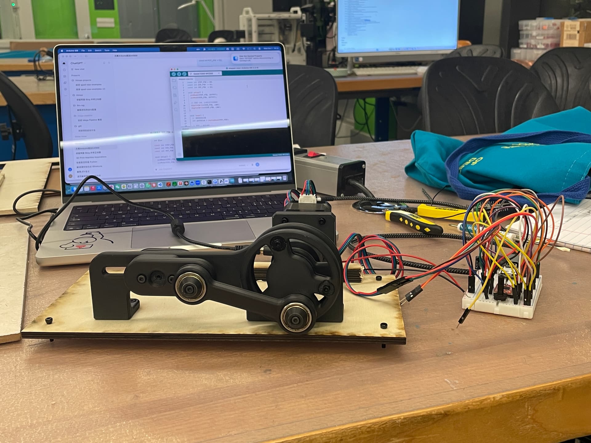 The breadboard controller connected to the 3D-printed motion mechanism
