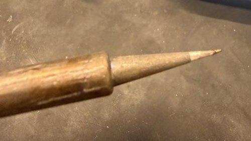 The thin conical soldering tip