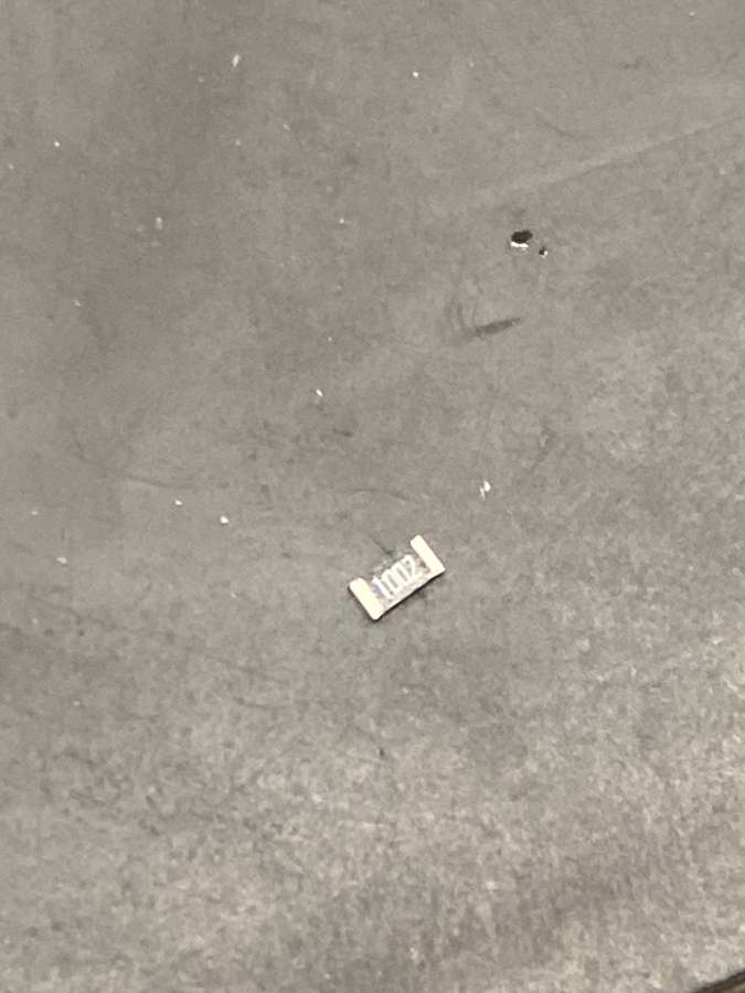 A tiny 1206 resistor on the bench