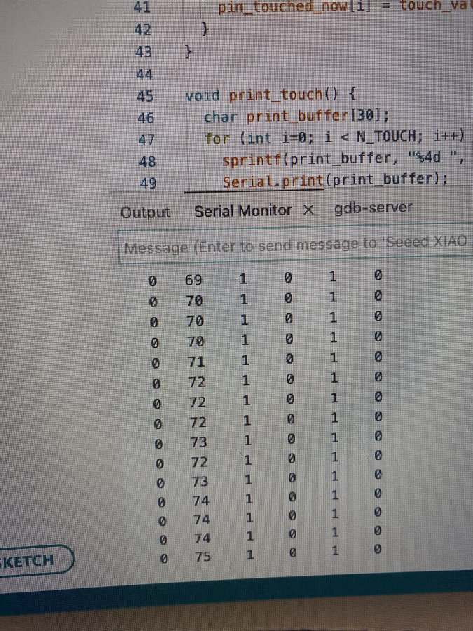 Serial Monitor showing six columns of touch values, with the second column around 70