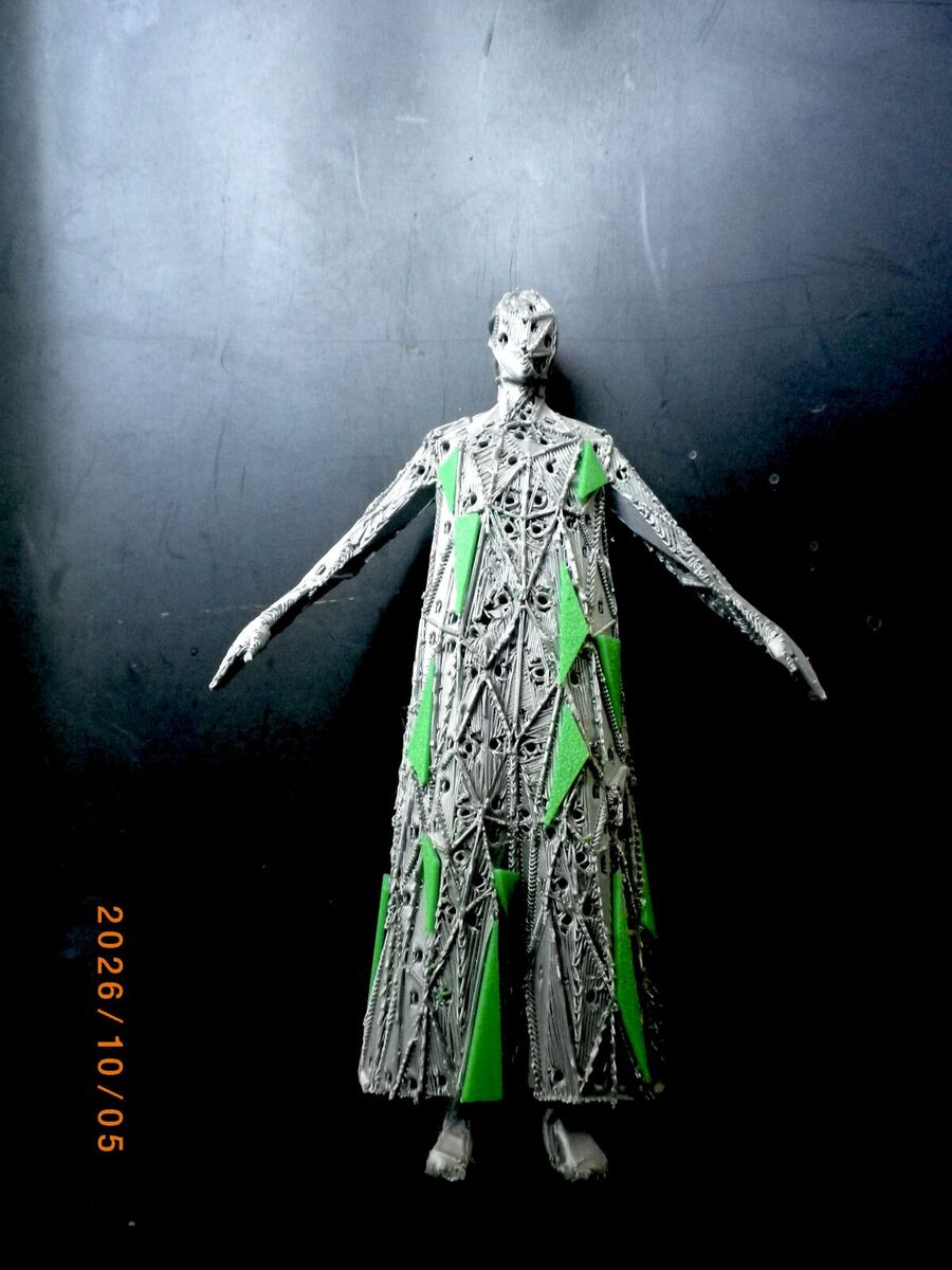 The same figure with some green triangle panels attached