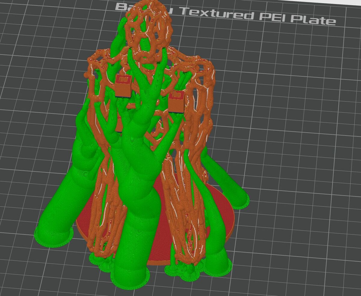 Bambu Studio preview of the figure with green tree supports branching around it