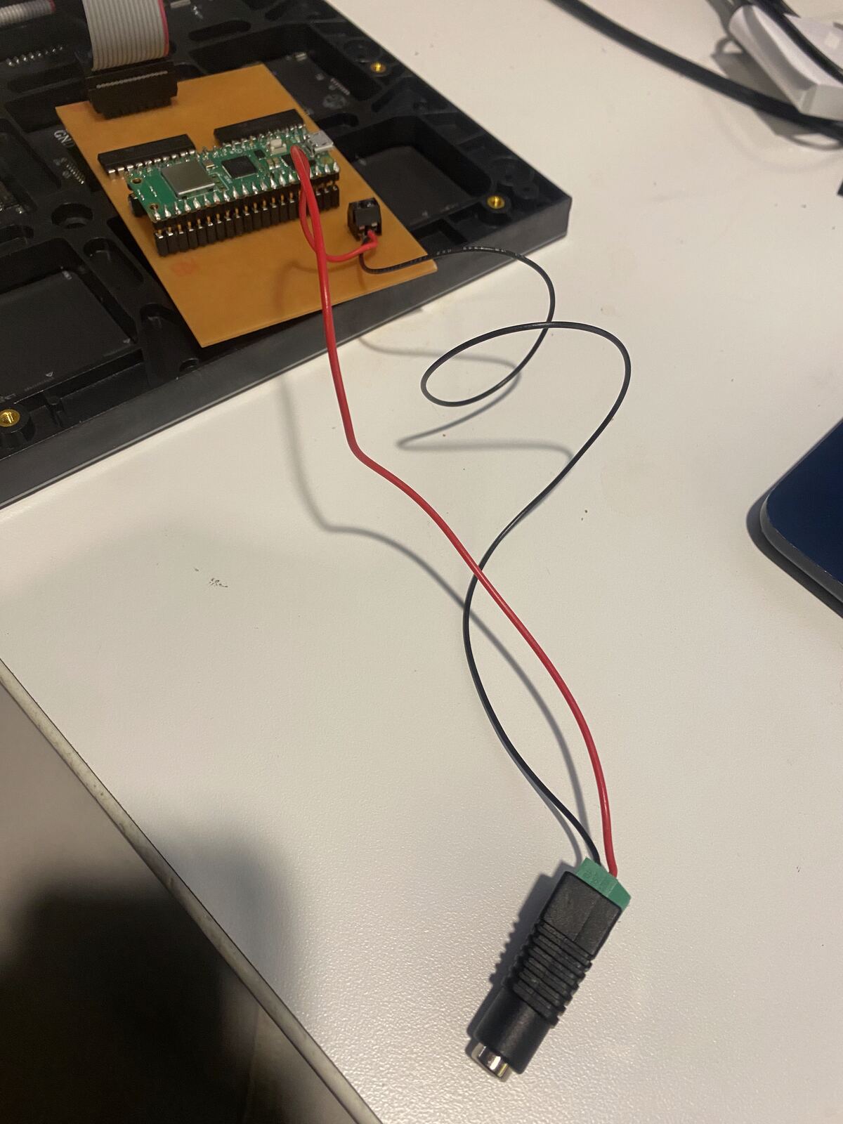The board wired to the DC jack's screw terminal