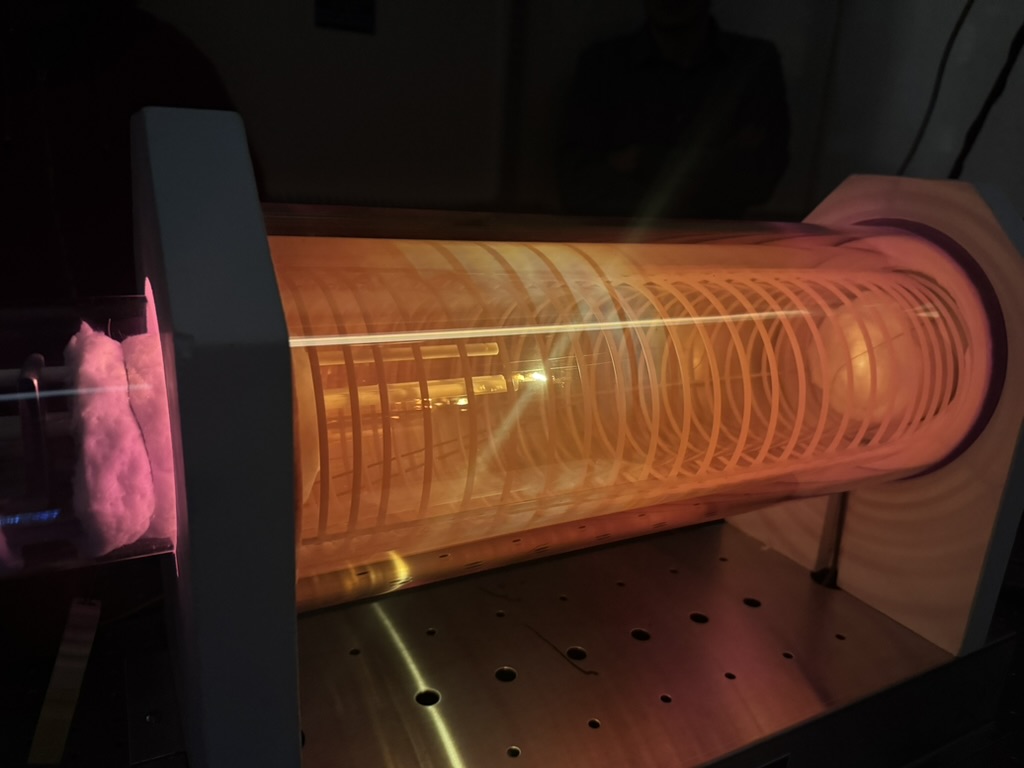 Illuminated cylindrical experimental apparatus on a laboratory optical table